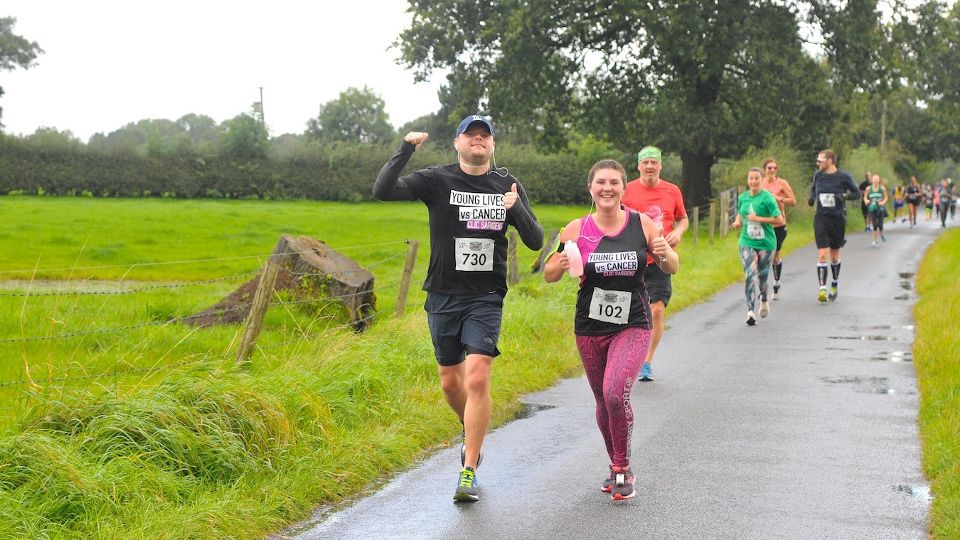 Runners in good spirits at a wet Cheshire Half Marathon