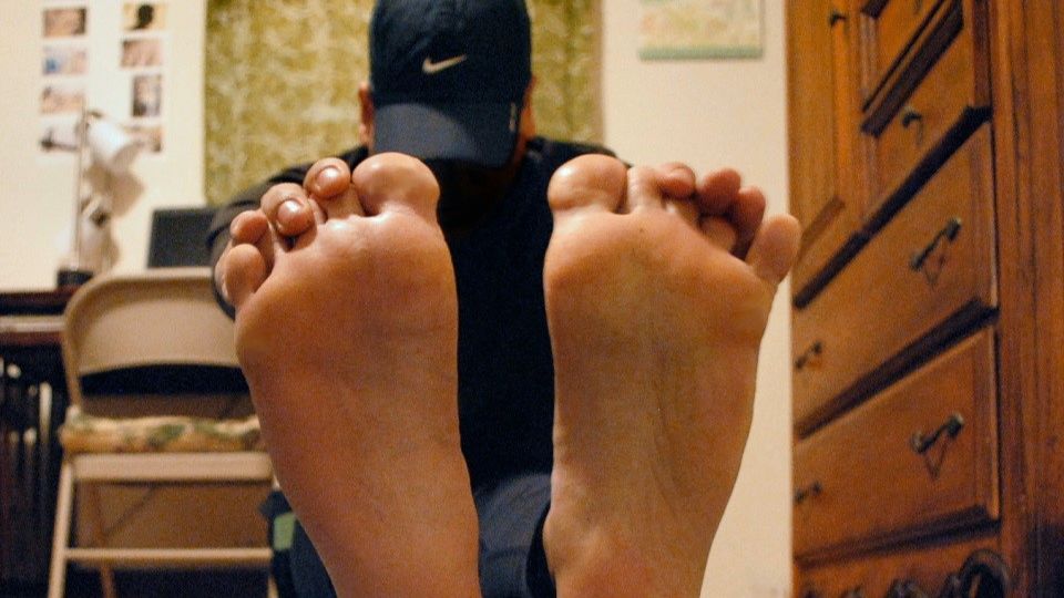 Runner stretching barefoot