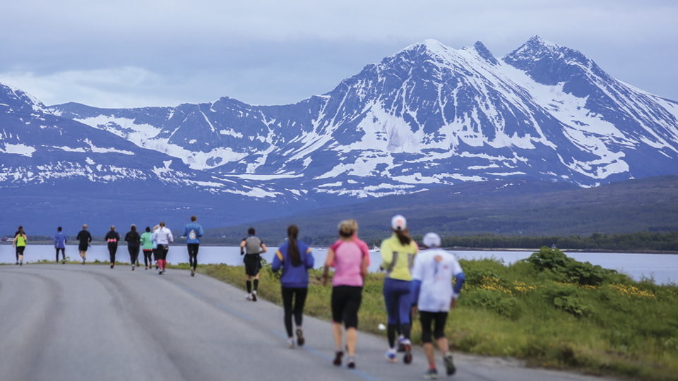 Runners In Norwegian landscape