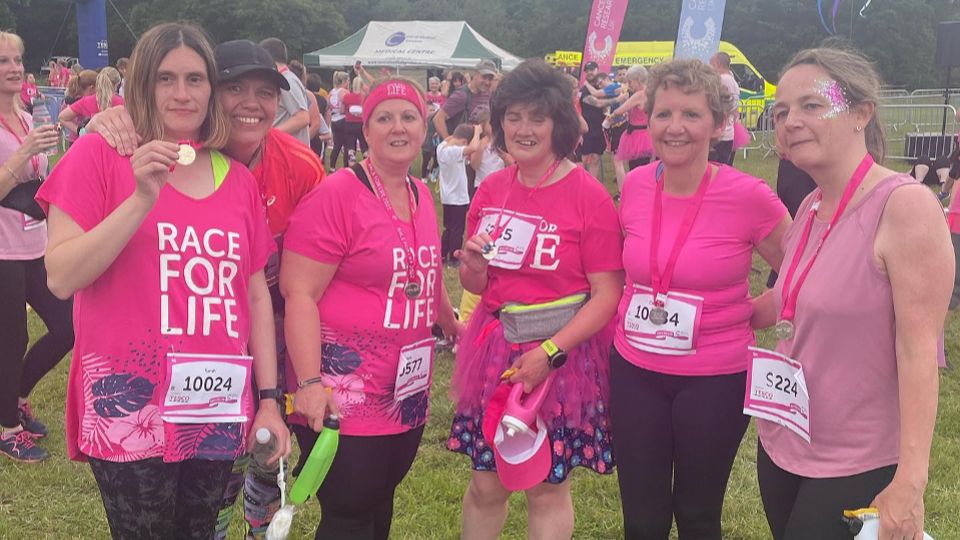 Proudly showing their medals at the Race for Life Trentham Gardens 5K