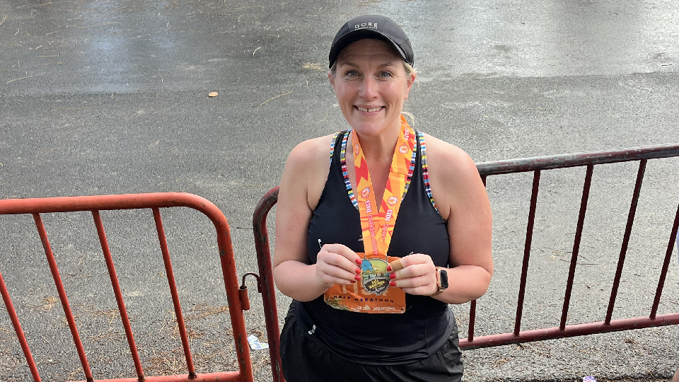 Louise and half marathon medal