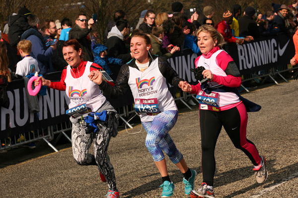 three happy girls after finishing MK Half Marathon