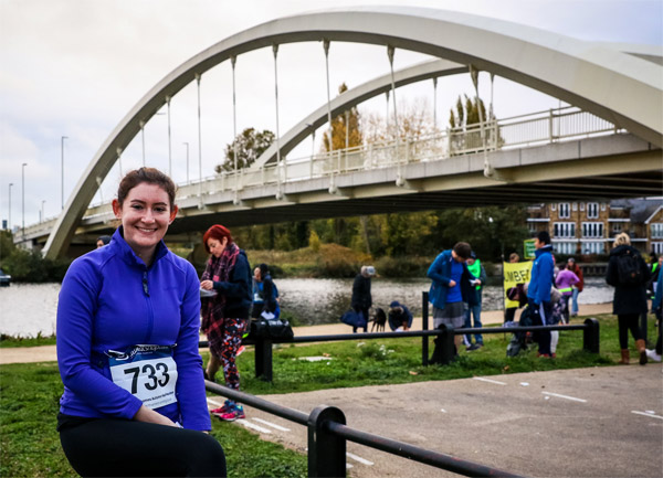 Finisher in front of the Walton Bridge