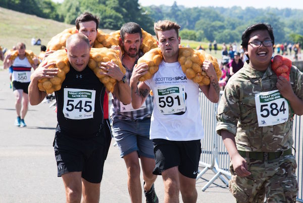 runners with sacks of potatoes