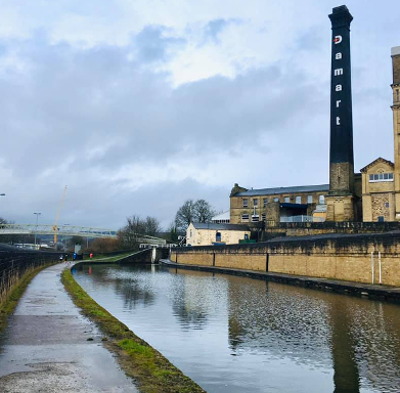 Runners Alongside The Huddersfield Canal At The Slawit Slog